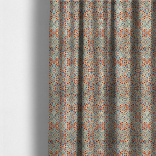 The fabric used to create these made-to-measure curtains is a decorative fabric with an Ottoman-style floral print. The design consists of repeating cobalt blue and turquoise tulips and deep red carnations intertwined with long, curving green leaves. The pattern mimics 16th-century Mediterranean ceramic tile art.