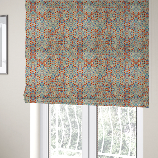 The fabric used to create these Roman blinds is a decorative fabric with an Ottoman-style floral print. The design consists of repeating cobalt blue and turquoise tulips and deep red carnations intertwined with long, curving green leaves. The pattern mimics 16th-century Mediterranean ceramic tile art.