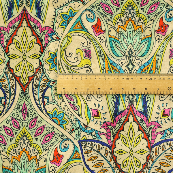 Vibrant bohemian paisley fabric with an intricate damask-style pattern featuring teal, yellow, pink, and orange motifs accented by bold black outlines on a warm cream background.