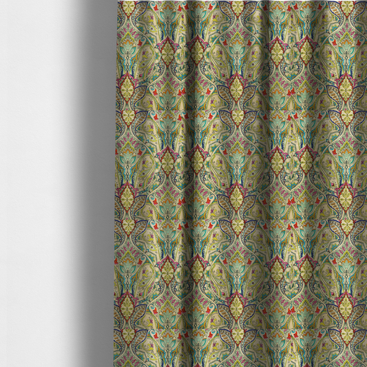 The fabric used to create these made-to-measure curtains is a vibrant bohemian paisley fabric with an intricate damask-style pattern featuring teal, yellow, pink, and orange motifs accented by bold black outlines on a warm cream background