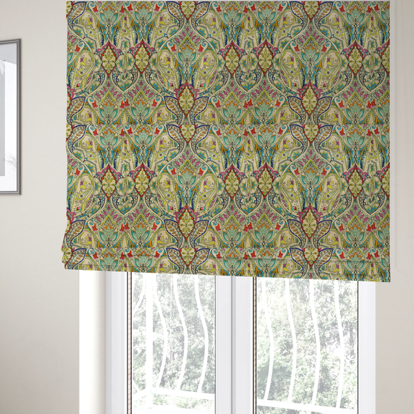 The fabric used to create these Roman blinds is a vibrant bohemian paisley fabric with an intricate damask-style pattern featuring teal, yellow, pink, and orange motifs accented by bold black outlines on a warm cream background