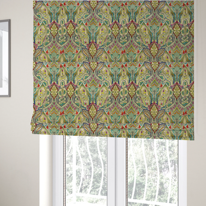 The fabric used to create these Roman blinds is a vibrant bohemian paisley fabric with an intricate damask-style pattern featuring teal, yellow, pink, and orange motifs accented by bold black outlines on a warm cream background
