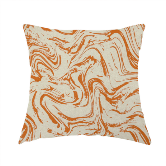 The fabric used to create this handmade cushion is an abstract marbled fabric featuring fluid, organic swirls in a warm burnt orange colour over a textured cream-colored background.