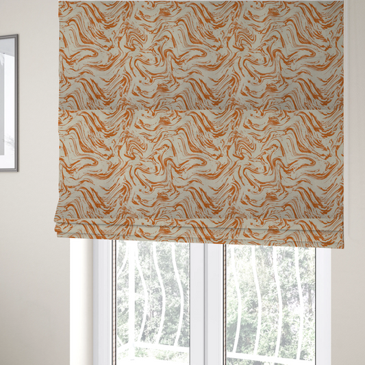 The fabric used to create these Roman blinds is an abstract marbled fabric featuring fluid, organic swirls in a warm burnt orange colour over a textured cream-colored background.