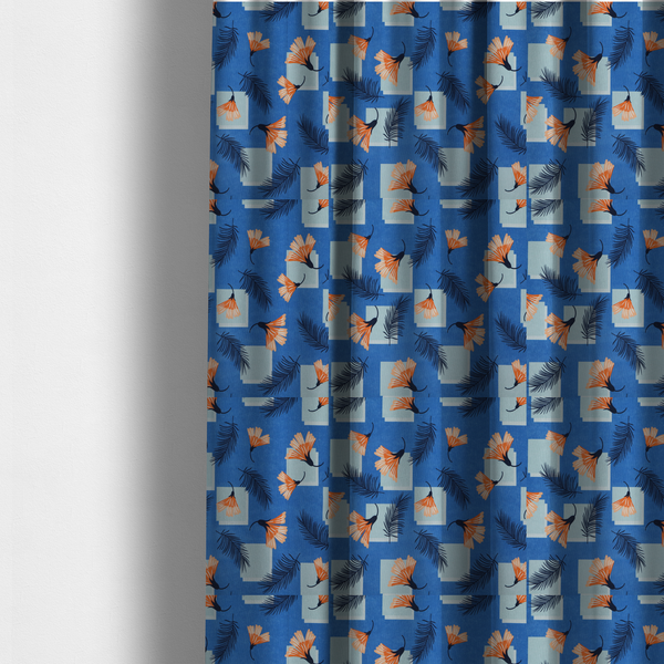 The fabric used to create these made-to-measure curtains is a modern tropical fabric featuring a vibrant cobalt blue background with scattered orange fan-shaped flowers, dark navy palm fronds, and pale blue geometric square overlays.