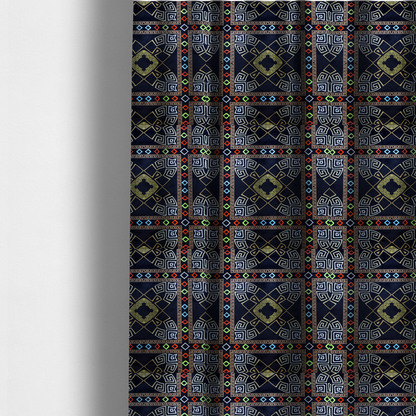 The fabric used to create these made-to-measure curtains is a luxury black fabric featuring a structured gold Greek Key and geometric medallion pattern, bordered by a vibrant row of small neon red, green, and blue diamond shapes.