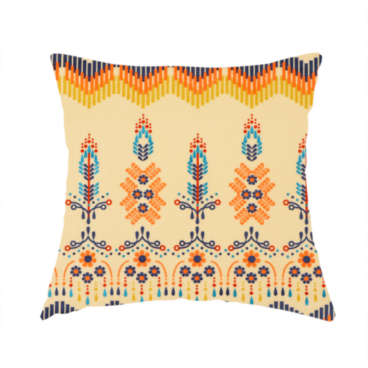 The fabric used to create this handmade cushion is a folk-art style fabric featuring horizontal rows of stylized orange and navy floral pillars and geometric chevron borders on a warm cream background