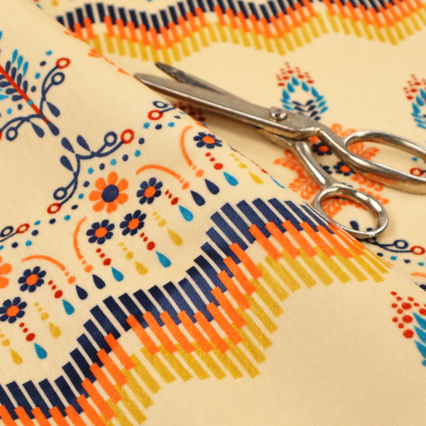 Folk-art style fabric featuring horizontal rows of stylized orange and navy floral pillars and geometric chevron borders on a warm cream background