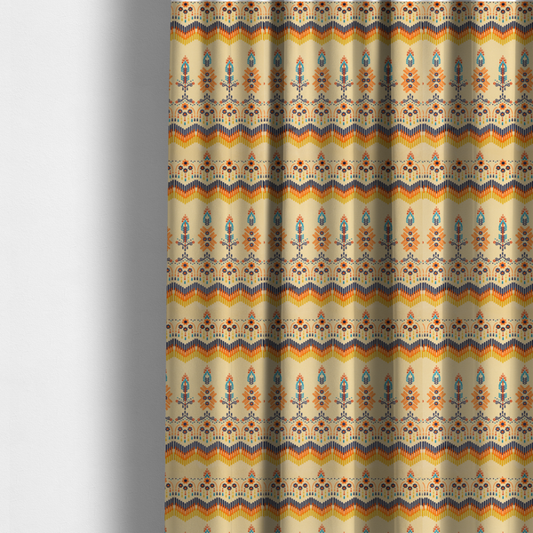 The fabric used to create these made-to-measure curtains is a folk-art style fabric featuring horizontal rows of stylized orange and navy floral pillars and geometric chevron borders on a warm cream background