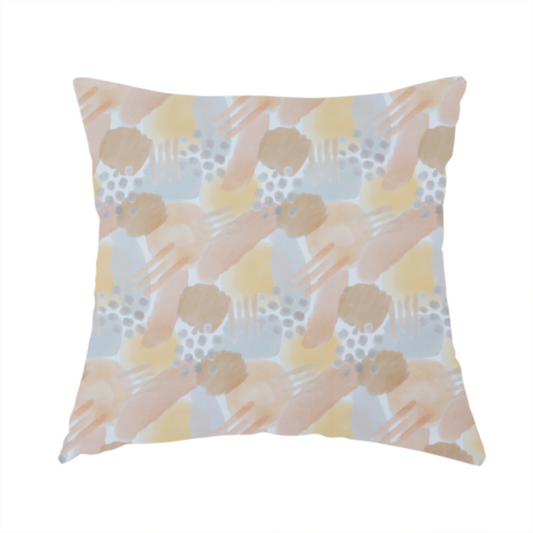 The fabric used to create this handmade cushion is a dreamy, minimalist textile print featuring overlapping translucent washes of pastel colours. Soft blush and buttercup yellow shapes are layered with dusty blue blocks, delicate stippled dot patterns, and thin diagonal lines, creating a rhythmic yet airy impressionist design.