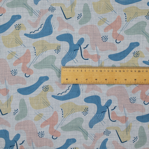 Abstract mid-century modern fabric featuring fluid organic shapes in dusty blue, blush pink, and mustard yellow with fine black line accents and stippled dot clusters on a light grey linen-textured background.