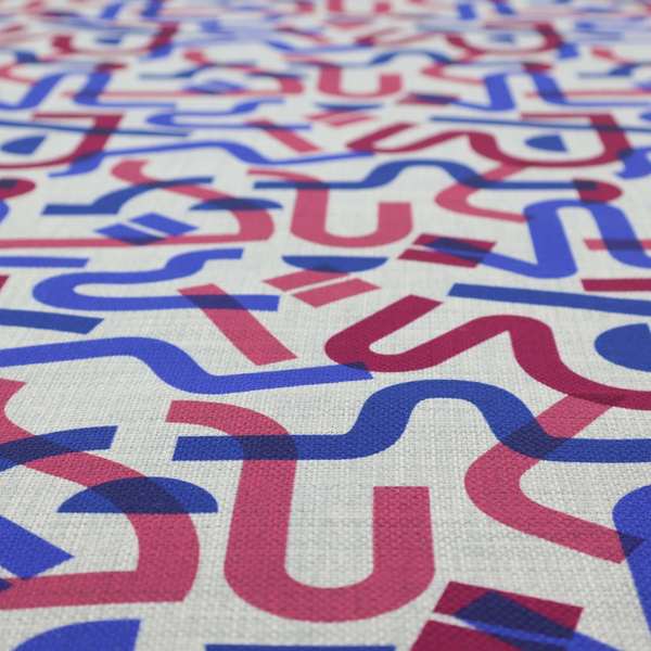 Abstract pattern of overlapping blue and magenta ribbon-like curves and geometric shapes on a light grey textured fabric, creating dark purple tones at intersections.