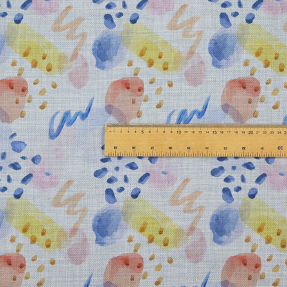Abstract watercolour pattern of blue, ochre, and peach shapes with squiggly lines and navy dots on a light grey linen-textured background.