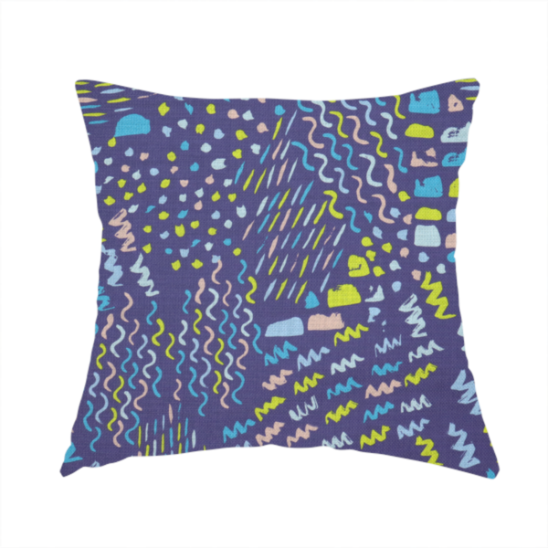 The fabric used to create this handmade cushion is a dense abstract pattern featuring a variety of hand-drawn squiggles, dots, and dashes in bright, contrasting tones scattered across a deep, dark-coloured textured fabric.