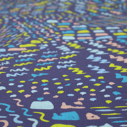 A dense abstract pattern featuring a variety of hand-drawn squiggles, dots, and dashes in bright, contrasting tones scattered across a deep, dark-coloured textured fabric.