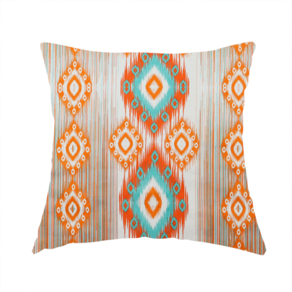 The fabric used to create this handmade cushion is a striking geometric fabric featuring vibrant diamond medallions with blurred, ikat-style edges layered over a dynamic pattern of fine vertical streaks on a light background.