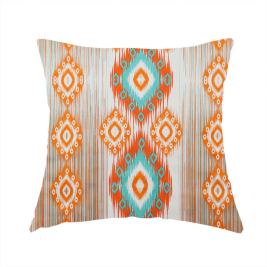 The fabric used to create this handmade cushion is a striking geometric fabric featuring vibrant diamond medallions with blurred, ikat-style edges layered over a dynamic pattern of fine vertical streaks on a light background.