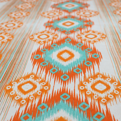 A striking geometric fabric featuring vibrant diamond medallions with blurred, ikat-style edges layered over a dynamic pattern of fine vertical streaks on a light background.