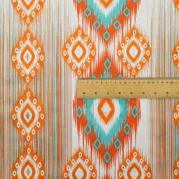 A striking geometric fabric featuring vibrant diamond medallions with blurred, ikat-style edges layered over a dynamic pattern of fine vertical streaks on a light background.