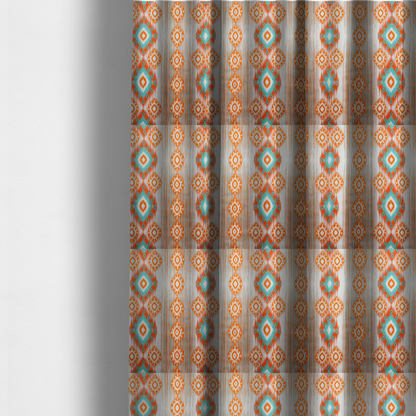 The fabric used to create these made-to-measure curtains is a striking geometric fabric featuring vibrant diamond medallions with blurred, ikat-style edges layered over a dynamic pattern of fine vertical streaks on a light background.