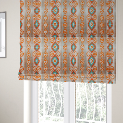 The fabric used to create these Roman blinds is a striking geometric fabric featuring vibrant diamond medallions with blurred, ikat-style edges layered over a dynamic pattern of fine vertical streaks on a light background.