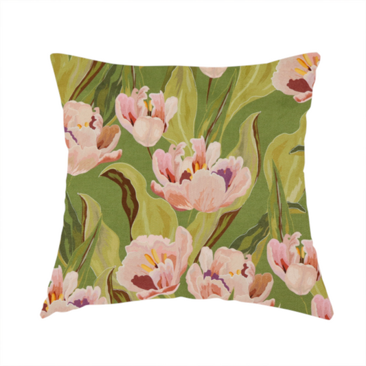 The fabric used to create this handmade cushion is a lush, large-scale botanical pattern featuring soft-textured tulips and flowing green foliage in a romantic, painterly style across a solid green background.