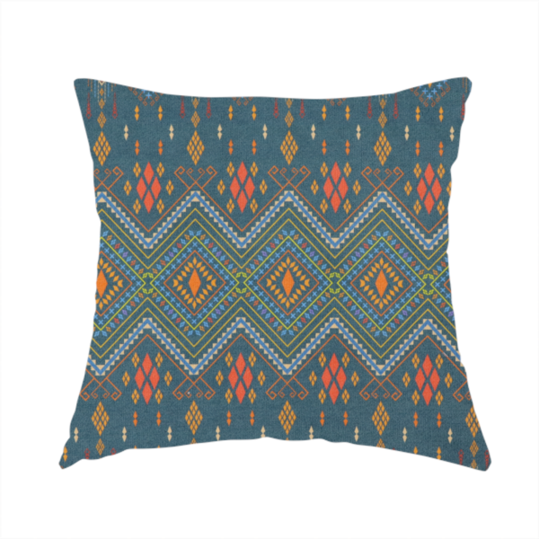 The fabric used to create this handmade cushion is an intricate geometric fabric featuring a central band of vibrant diamond motifs and tiered horizontal borders of tribal-style symbols and linework on a solid, deep-toned background.