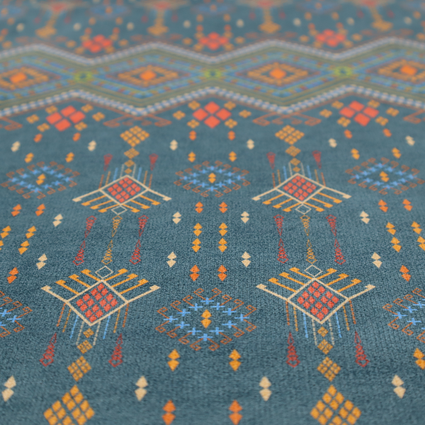 An intricate geometric fabric featuring a central band of vibrant diamond motifs and tiered horizontal borders of tribal-style symbols and linework on a solid, deep-toned background.