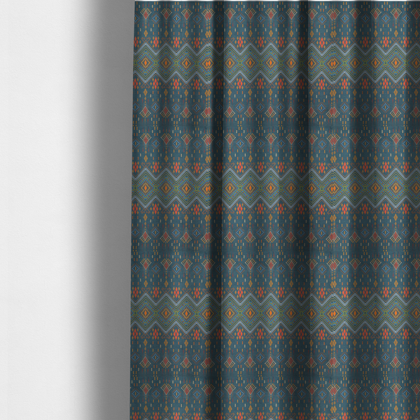 The fabric used to create these made-to-measure curtains is an intricate geometric fabric featuring a central band of vibrant diamond motifs and tiered horizontal borders of tribal-style symbols and linework on a solid, deep-toned background.