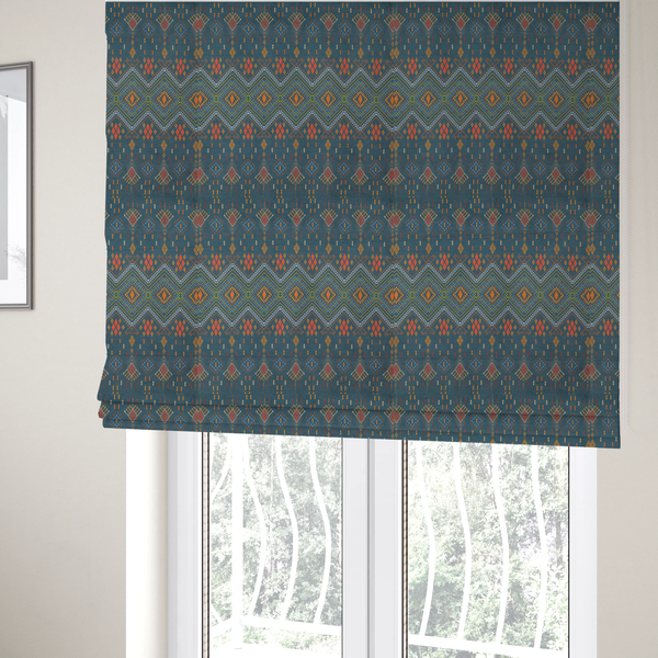 The fabric used to create these Roman blinds is an intricate geometric fabric featuring a central band of vibrant diamond motifs and tiered horizontal borders of tribal-style symbols and linework on a solid, deep-toned background.