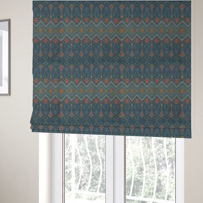 The fabric used to create these Roman blinds is an intricate geometric fabric featuring a central band of vibrant diamond motifs and tiered horizontal borders of tribal-style symbols and linework on a solid, deep-toned background.
