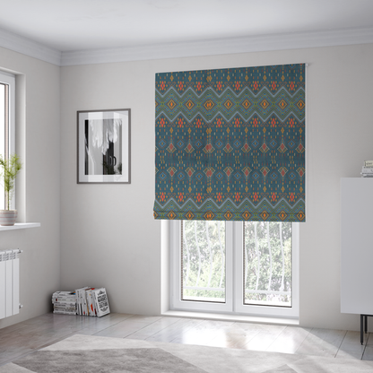 The fabric used to create these Roman blinds is an intricate geometric fabric featuring a central band of vibrant diamond motifs and tiered horizontal borders of tribal-style symbols and linework on a solid, deep-toned background.