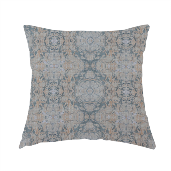 The fabric used to create this handmade cushion is a woven fabric featuring a symmetrical, repeating abstract pattern with a marble-like swirl effect in muted tones of dusty blue, sandy tan, and soft grey.