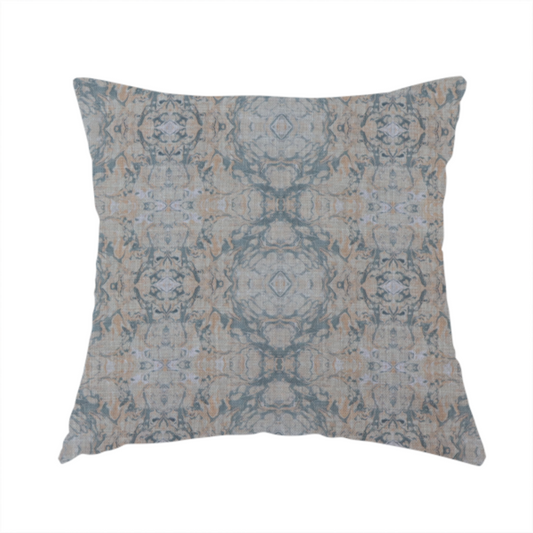 The fabric used to create this handmade cushion is a woven fabric featuring a symmetrical, repeating abstract pattern with a marble-like swirl effect in muted tones of dusty blue, sandy tan, and soft grey.