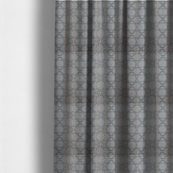 The fabric used to create these made-to-measure curtains is a woven fabric featuring a symmetrical, repeating abstract pattern with a marble-like swirl effect in muted tones of dusty blue, sandy tan, and soft grey.