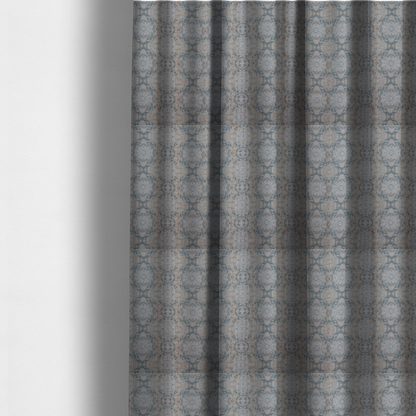 The fabric used to create these made-to-measure curtains is a woven fabric featuring a symmetrical, repeating abstract pattern with a marble-like swirl effect in muted tones of dusty blue, sandy tan, and soft grey.