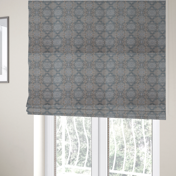 The fabric used to create these Roman blinds is a woven fabric featuring a symmetrical, repeating abstract pattern with a marble-like swirl effect in muted tones of dusty blue, sandy tan, and soft grey.
