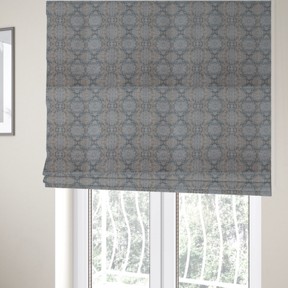 The fabric used to create these Roman blinds is a woven fabric featuring a symmetrical, repeating abstract pattern with a marble-like swirl effect in muted tones of dusty blue, sandy tan, and soft grey.