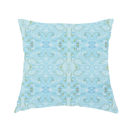 The fabric used to create this handmade cushion is a repeating, symmetrical pattern of fluid, marble-like swirls in shades of sky blue, white, and subtle golden-yellow on a light blue background.
