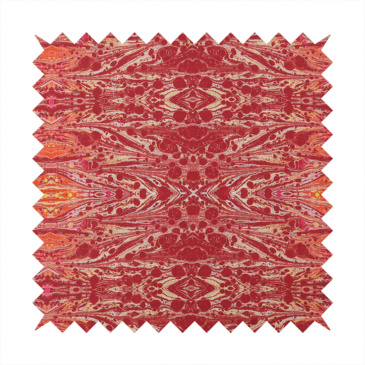 A repeating, symmetrical pattern of fluid, marble-like swirls in rich shades of deep red, fiery orange, and bright yellow on a textured fabric background.