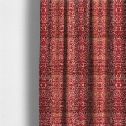 The fabric used to create these made-to-measure curtains is a repeating, symmetrical pattern of fluid, marble-like swirls in rich shades of deep red, fiery orange, and bright yellow on a textured fabric background.