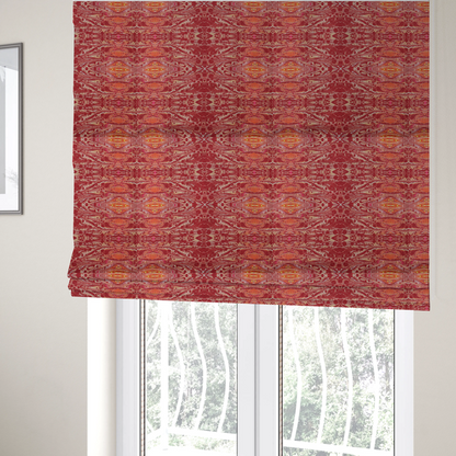 The fabric used to create these Roman blinds is a repeating, symmetrical pattern of fluid, marble-like swirls in rich shades of deep red, fiery orange, and bright yellow on a textured fabric background.
