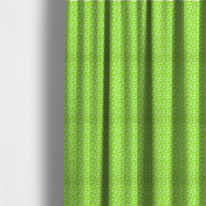 The fabric used to create these made-to-measure curtains is a vibrant, lime-green fabric featuring a dense, repeating pattern of elegant, white, swirling botanical motifs