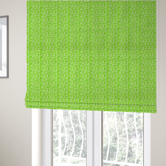 The fabric used to create these Roman blinds is a vibrant, lime-green fabric featuring a dense, repeating pattern of elegant, white, swirling botanical motifs