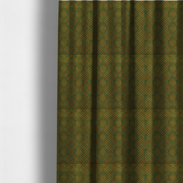 The fabric used to create these made-to-measure curtains is a repeating, decorative fabric pattern featuring ornate, gold-toned paisley motifs centred on a deep forest green background. The design is structured around a subtle lattice of small, delicate floral sprigs, creating a traditional, block-printed aesthetic with a slightly weathered, vintage texture.