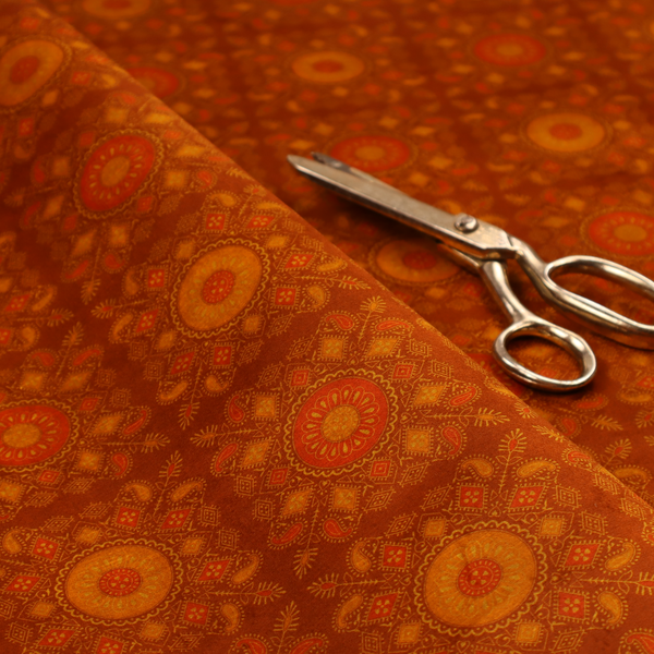 A warm, ornate repeating pattern with a rich, vintage aesthetic. It draws heavy inspiration from traditional South Asian and Middle Eastern textile designs, specifically echoing elements of Mandala art and Paisley motifs.