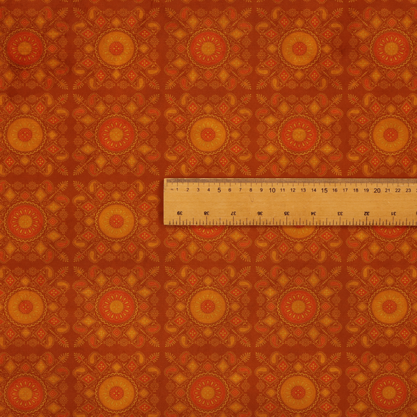 A warm, ornate repeating pattern with a rich, vintage aesthetic. It draws heavy inspiration from traditional South Asian and Middle Eastern textile designs, specifically echoing elements of Mandala art and Paisley motifs.