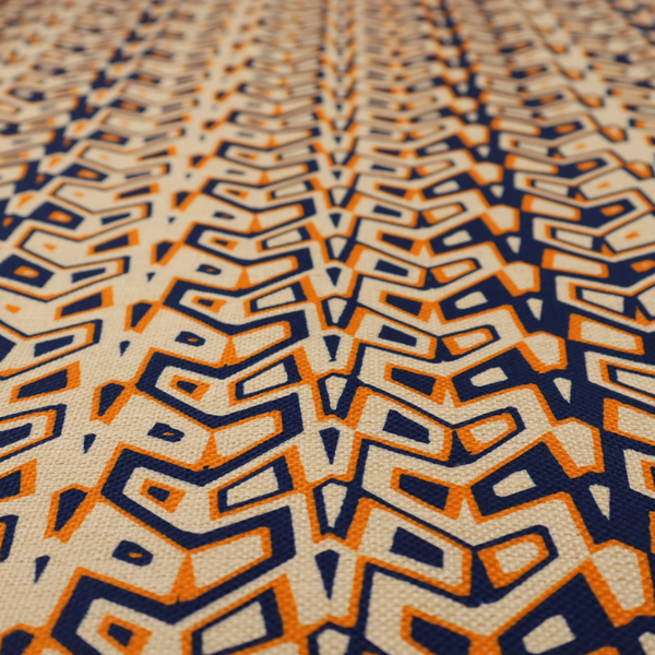 A dynamic, geometric textile pattern with a bold, tribal-inspired aesthetic. It utilizes sharp angles and high-contrast colours to create a sense of vertical movement and rhythmic energy.