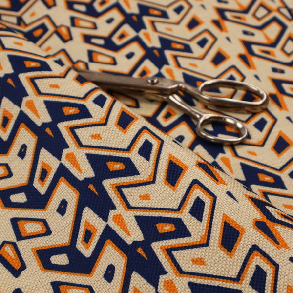 A dynamic, geometric textile pattern with a bold, tribal-inspired aesthetic. It utilizes sharp angles and high-contrast colours to create a sense of vertical movement and rhythmic energy.