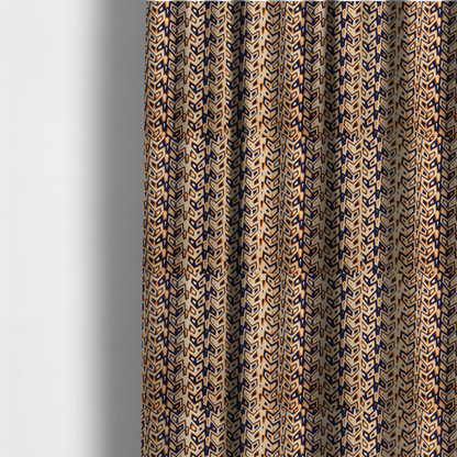 The fabric used to create these made-to-measure curtains is a dynamic, geometric textile pattern with a bold, tribal-inspired aesthetic. It utilizes sharp angles and high-contrast colours to create a sense of vertical movement and rhythmic energy.